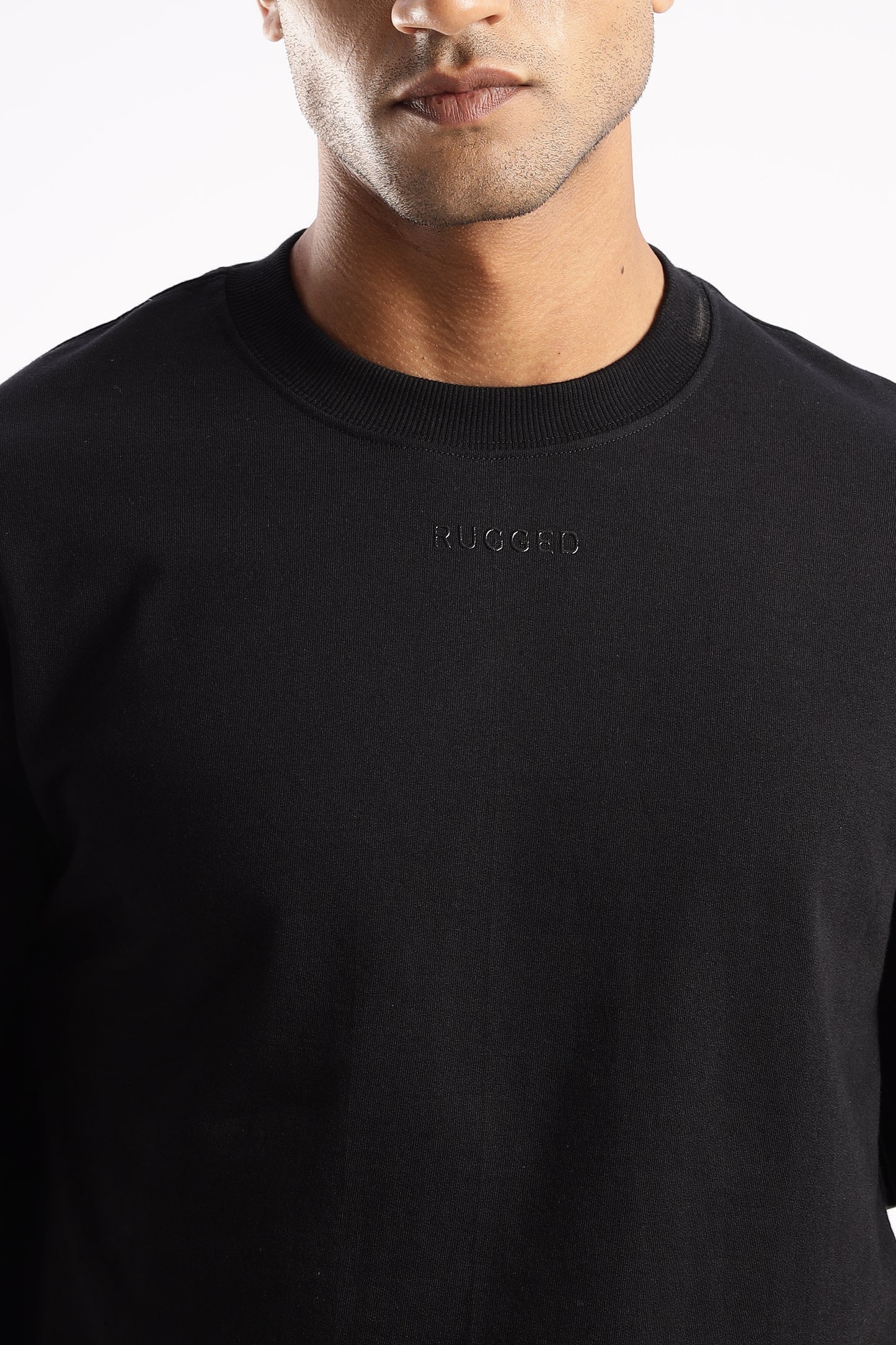 Close-up of Onyx Depth t-shirt showing soft texture and reinforced stitching
