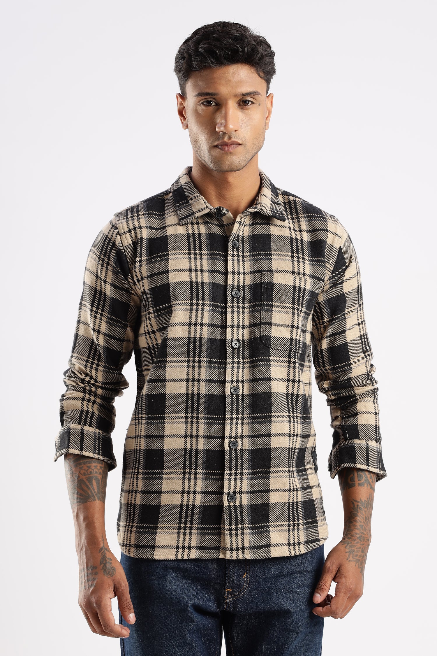 Model wearing Explorer Flannel Shirt in Desert Dune with beige check pattern and chest pockets